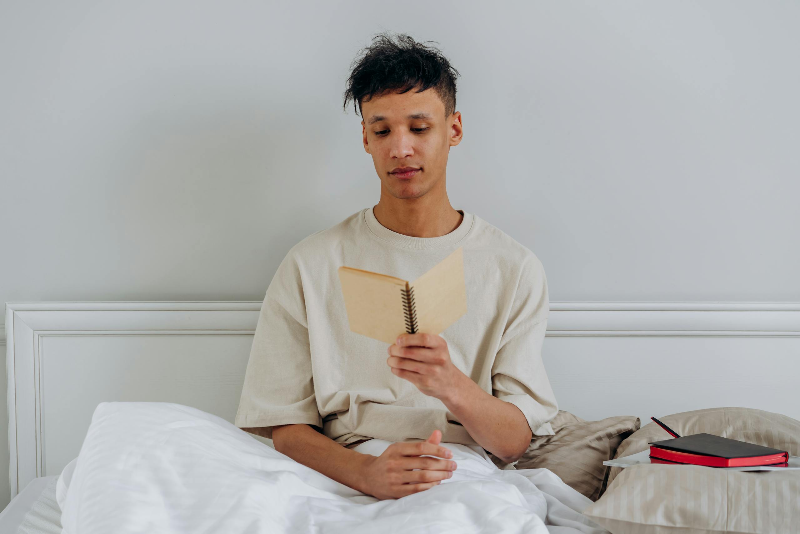 A Man Sitting on the Bed